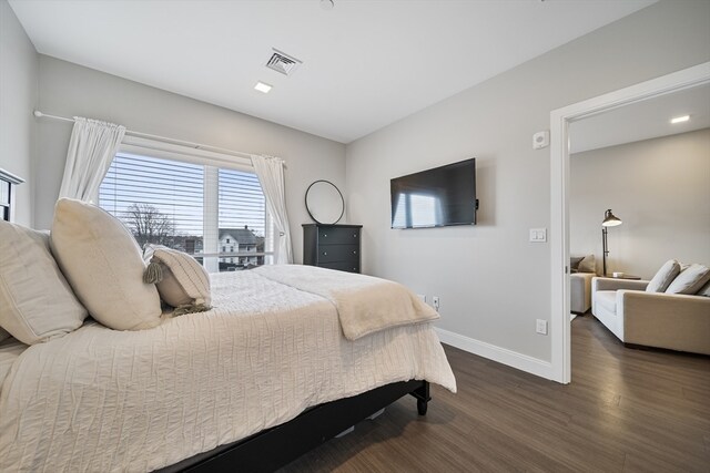 bedroom featuring dark hardwood / wood-style floors