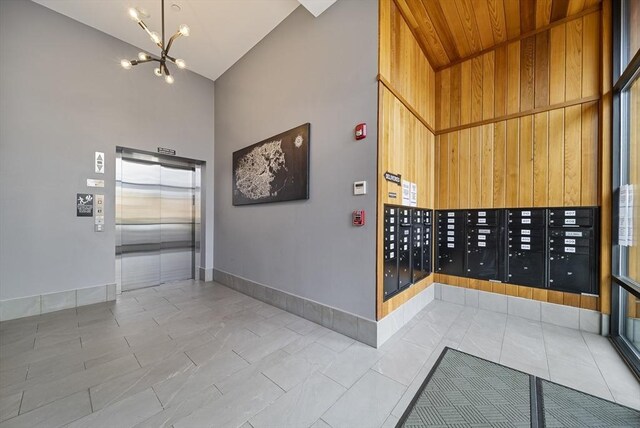 11 Walley St Unit 202, Boston, MA 02128 - view of home's community with high vaulted ceiling, mail area, and a chandelier