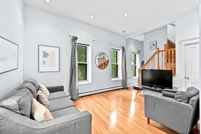 46A Cedar St Unit 2, Boston, MA 02119 - living room featuring a baseboard heating unit, stairs, light wood-style floors, and recessed lighting