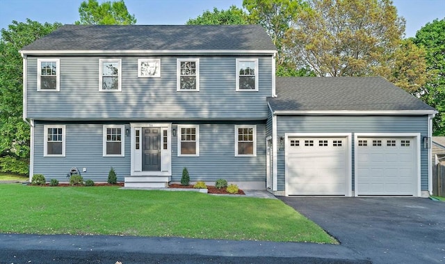 56 Lake St, Braintree, MA 02184 - colonial-style house with an attached garage, driveway, a front yard, and entry steps