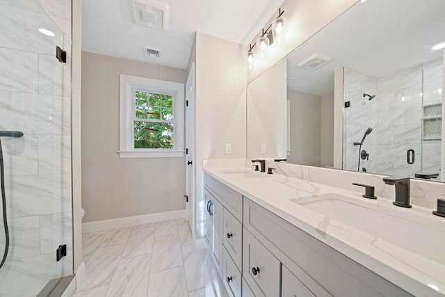 56 Lake St, Braintree, MA 02184 - bathroom featuring a stall shower, marble look tile flooring, double vanity, baseboards, and toilet