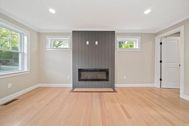 56 Lake St, Braintree, MA 02184 - unfurnished living room featuring light wood finished floors, a large fireplace, ornamental molding, baseboards, and recessed lighting