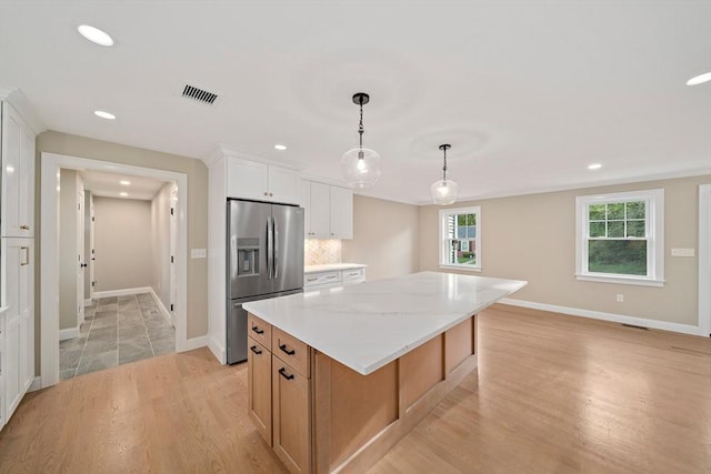 56 Lake St, Braintree, MA 02184 - kitchen featuring stainless steel fridge, light wood-style flooring, a center island, recessed lighting, and baseboards
