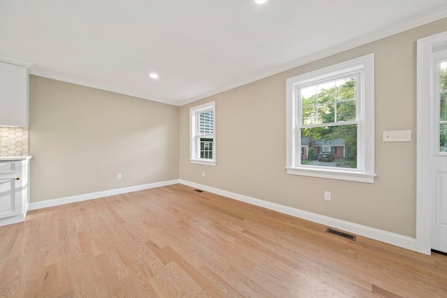 56 Lake St, Braintree, MA 02184 - unfurnished living room with baseboards, light wood-type flooring, ornamental molding, and recessed lighting