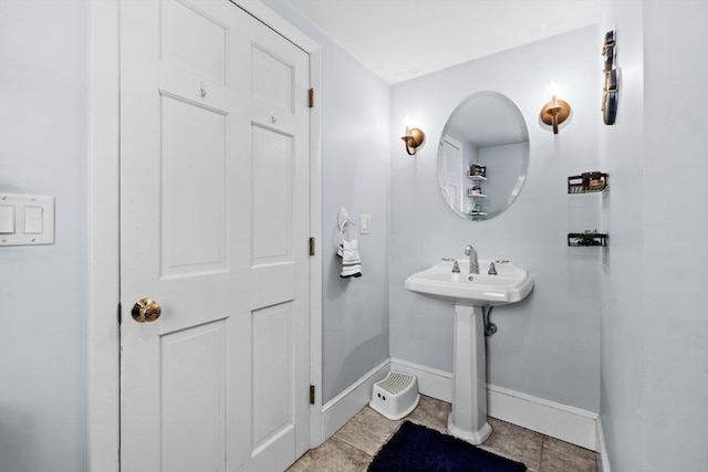 bathroom with tile patterned floors