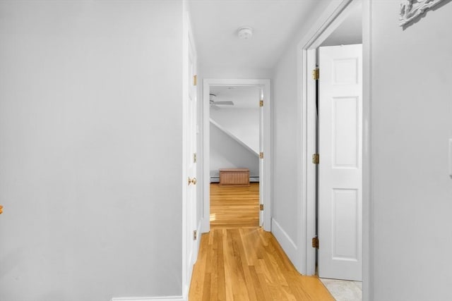 hall with light hardwood / wood-style floors