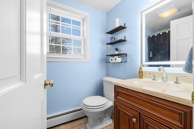 bathroom featuring vanity, toilet, tile patterned flooring, and a baseboard heating unit