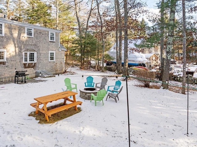 view of property's community with an outdoor fire pit