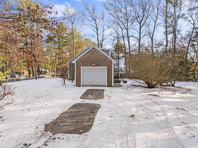 exterior space with an outbuilding and a garage