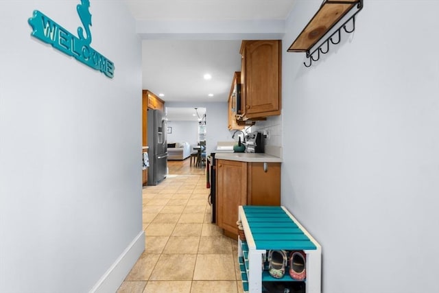 hallway with light tile patterned floors