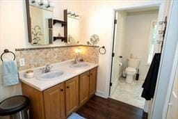 185 Baldwinville Rd, Winchendon, MA 01475 - full bath featuring toilet, decorative backsplash, double vanity, and wood finished floors