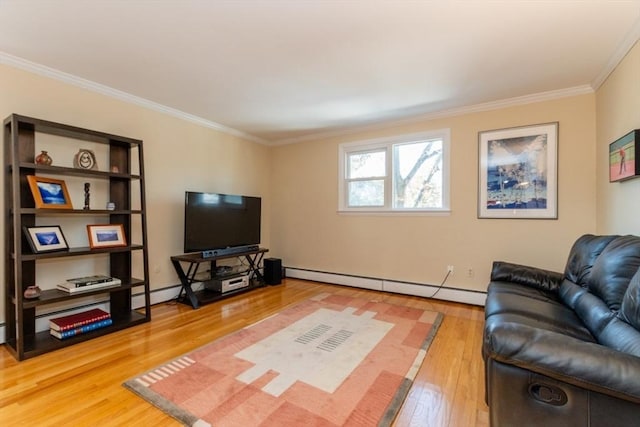 living area featuring hardwood / wood-style flooring, baseboard heating, and ornamental molding