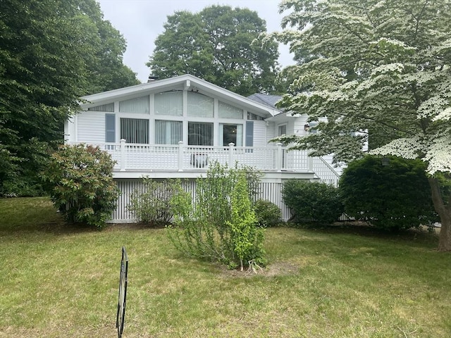 18 Blueberry Ln, Barnstable, MA 02648 - view of front of property with a front yard and a wooden deck