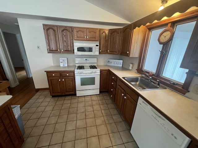 18 Blueberry Ln, Barnstable, MA 02648 - kitchen featuring white appliances, lofted ceiling, light countertops, and light tile patterned floors
