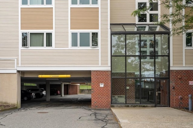 35 Des Moines Rd Unit 310, Quincy, MA 02169 - view of property featuring covered parking