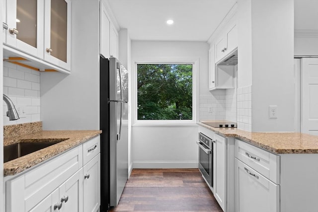 35 Des Moines Rd Unit 310, Quincy, MA 02169 - kitchen featuring appliances with stainless steel finishes, dark wood finished floors, white cabinetry, glass insert cabinets, and recessed lighting