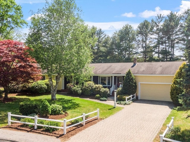 9 Bateson Dr, Andover, MA 01810 - view of front of home featuring a garage, driveway, and roof with shingles