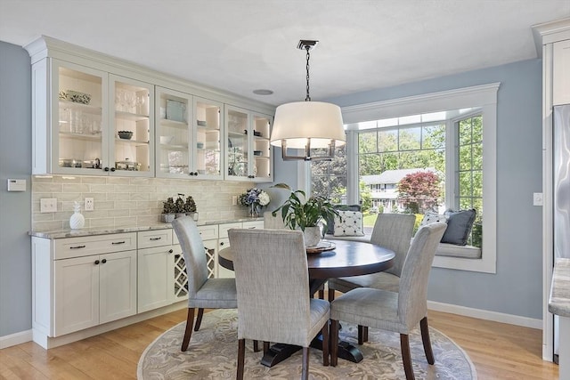 9 Bateson Dr, Andover, MA 01810 - dining area featuring light wood-style floors and baseboards
