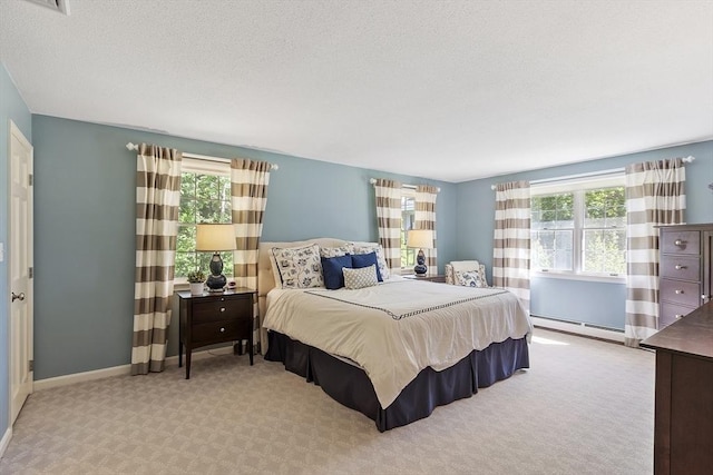 9 Bateson Dr, Andover, MA 01810 - carpeted bedroom featuring multiple windows, a baseboard radiator, and baseboards
