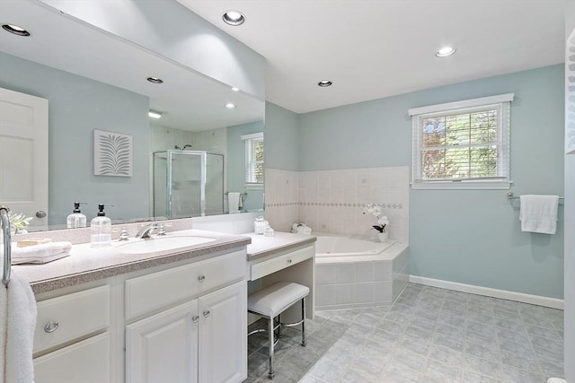 9 Bateson Dr, Andover, MA 01810 - bathroom featuring vanity, a bath, a shower stall, baseboards, and recessed lighting