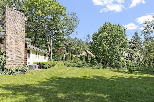 9 Bateson Dr, Andover, MA 01810 - view of green lawn with view of scattered trees and cooling unit