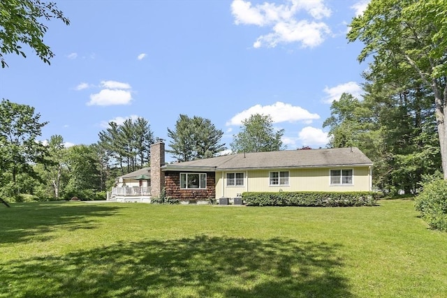 9 Bateson Dr, Andover, MA 01810 - view of front of house featuring a front lawn and a chimney