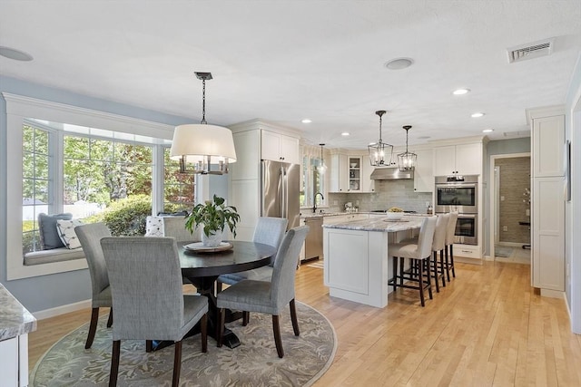 9 Bateson Dr, Andover, MA 01810 - dining room with baseboards, light wood-style flooring, and recessed lighting