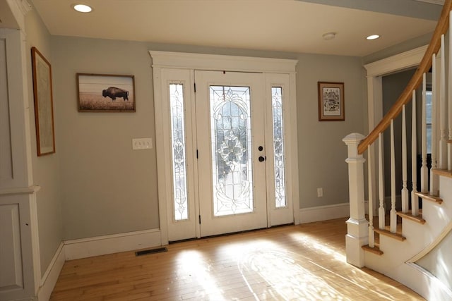 foyer with light hardwood / wood-style flooring