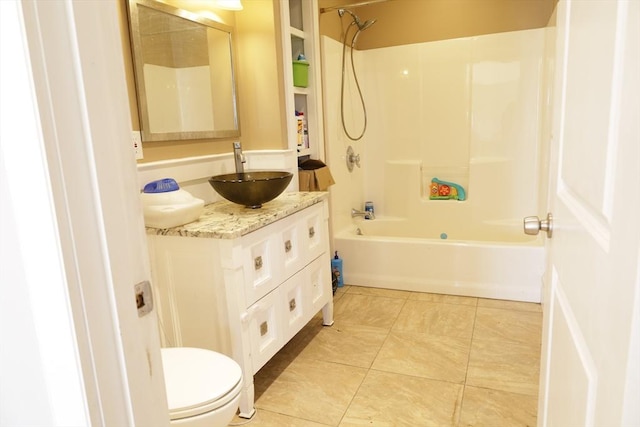 full bathroom featuring washtub / shower combination, vanity, toilet, and tile patterned flooring