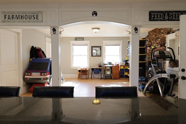 exercise room featuring light hardwood / wood-style floors