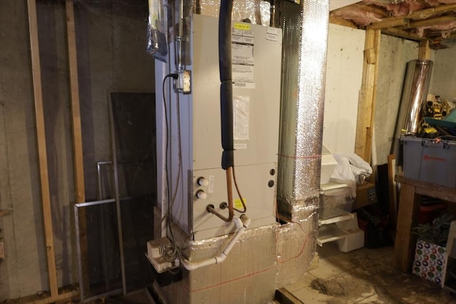 utility room featuring heating unit