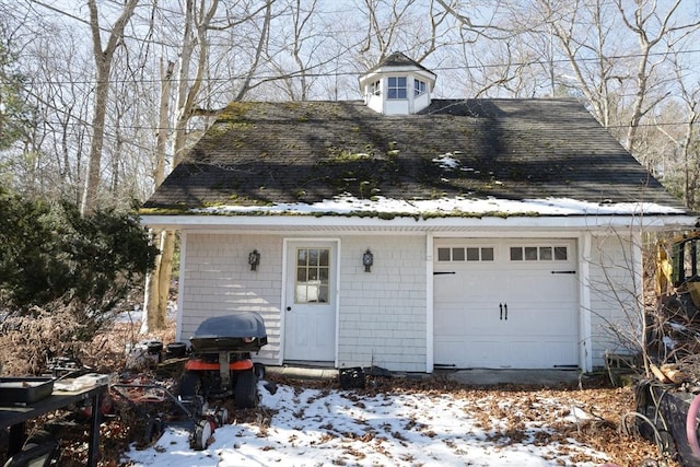 view of snow covered garage