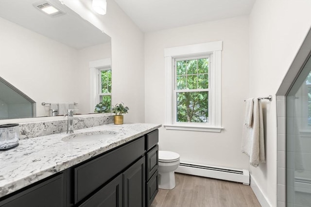 3 Regent Cir Unit 3, Boston, MA 02130 - full bathroom with a baseboard heating unit, vanity, toilet, and plenty of natural light