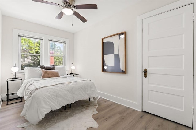 3 Regent Cir Unit 3, Boston, MA 02130 - bedroom featuring light wood finished floors, a baseboard radiator, baseboards, and a ceiling fan