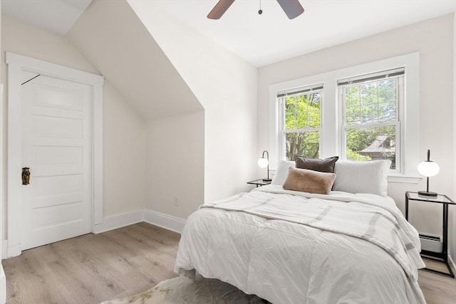 3 Regent Cir Unit 3, Boston, MA 02130 - bedroom featuring light wood-style floors, lofted ceiling, baseboard heating, baseboards, and a ceiling fan