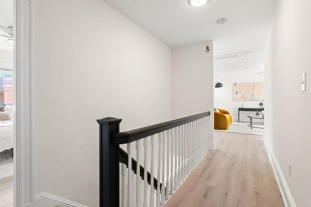 3 Regent Cir Unit 3, Boston, MA 02130 - hall featuring an upstairs landing, wood finished floors, and baseboards