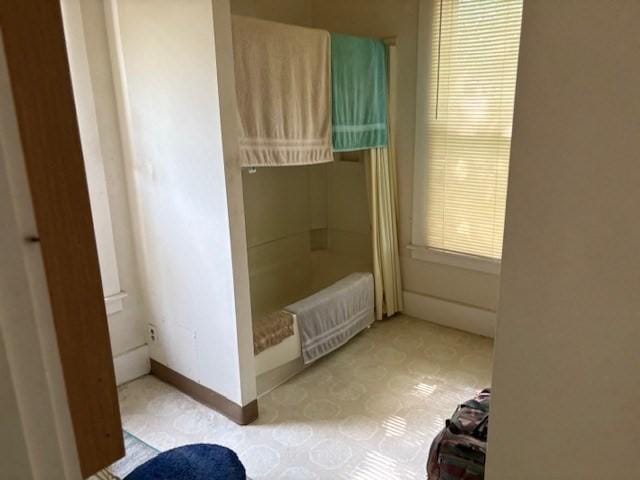 613 School St, Lowell, MA 01851 - full bathroom with radiator, baseboards, shower / bath combo, and tile patterned floors