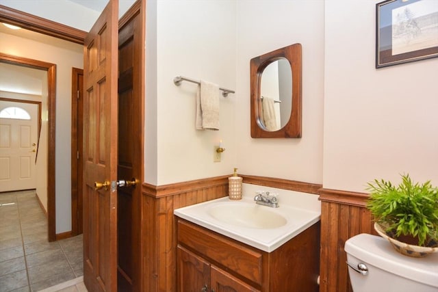 33 Rockmeadow Rd, Uxbridge, MA 01569 - bathroom with toilet, vanity, a wainscoted wall, and tile patterned floors
