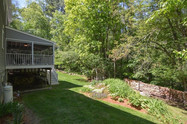 33 Rockmeadow Rd, Uxbridge, MA 01569 - view of grassy yard with stairs, a sunroom, and a forest view