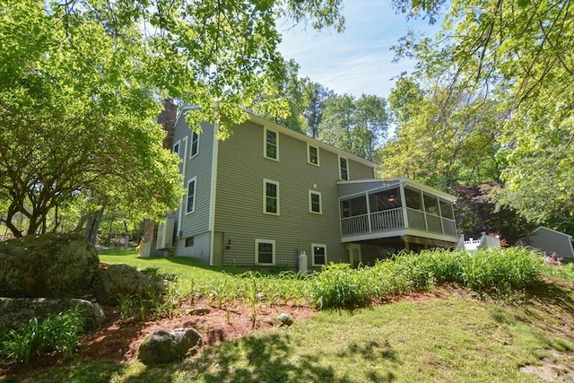 33 Rockmeadow Rd, Uxbridge, MA 01569 - back of property featuring a sunroom, a chimney, and a yard
