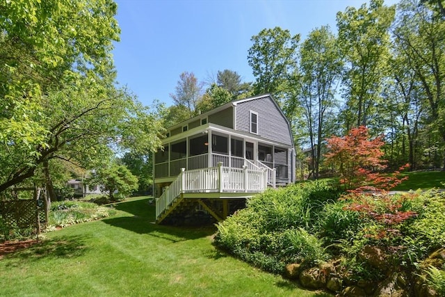 33 Rockmeadow Rd, Uxbridge, MA 01569 - back of property with a sunroom, stairway, and a lawn