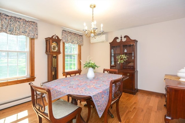 33 Rockmeadow Rd, Uxbridge, MA 01569 - dining room with a chandelier, a wall mounted AC, light wood finished floors, and a baseboard radiator
