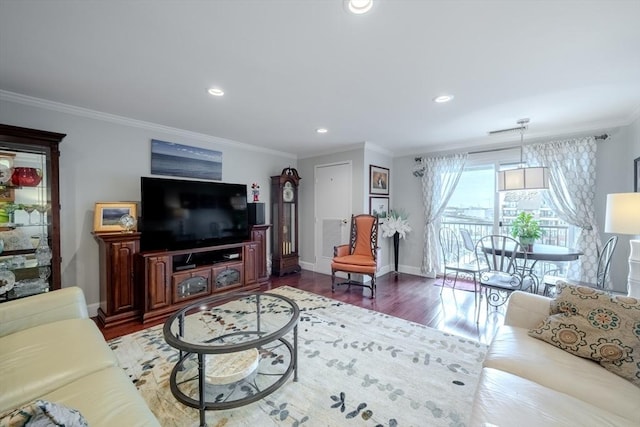 living room with hardwood / wood-style floors and ornamental molding