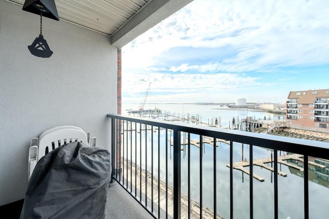 balcony featuring a water view