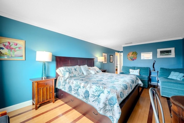 bedroom featuring hardwood / wood-style flooring and ornamental molding