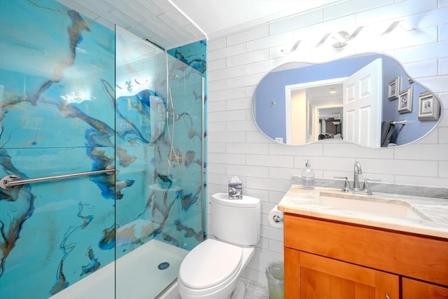 bathroom featuring tile walls, a tile shower, vanity, decorative backsplash, and toilet