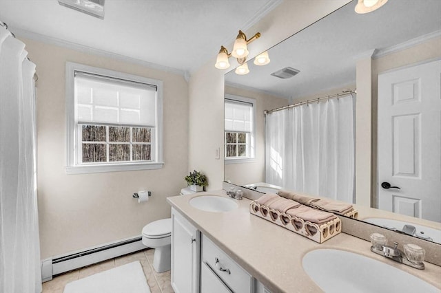 bathroom with a baseboard heating unit, tile patterned flooring, crown molding, and vanity