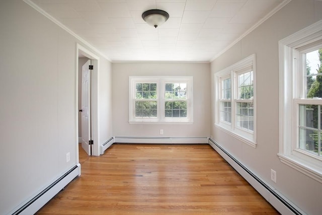 329 Read St, Somerset, MA 02726 - unfurnished room with baseboard heating, ornamental molding, plenty of natural light, and light wood-type flooring