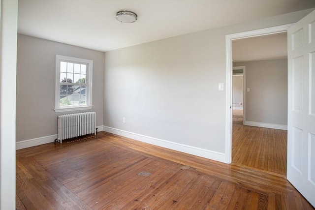 329 Read St, Somerset, MA 02726 - empty room with radiator and wood-type flooring