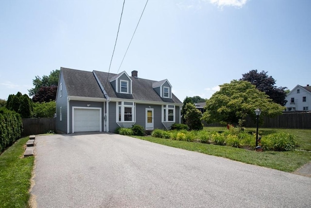 329 Read St, Somerset, MA 02726 - cape cod-style house with a garage, driveway, and a chimney
